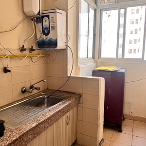 Kitchen in 2 BHK Apartment at Logix Blossom Greens, Sector 143 – for Sale