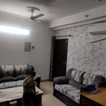 Living Room in 2 BHK Apartment at Gardenia Golf City, Noida Central – for Rent