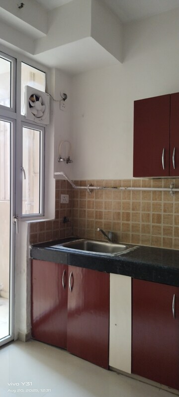 Kitchen in 3 BHK Apartment at Mahagun Mywoods, Sector 16c Greater Noida – for Rent
