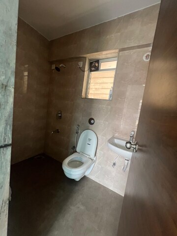 Bathroom in 2 BHK Apartment at Cosmos Habitat, Majiwada – for Sale