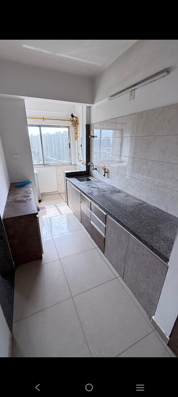 Kitchen in 1 BHK Apartment at Applewood Satyesh Residency, Shela – for Rent