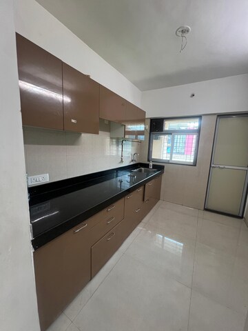 Kitchen in 2 BHK Apartment at Cosmos Habitat, Majiwada – for Rent