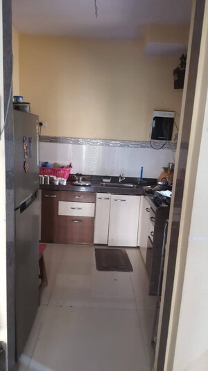 Kitchen in 2 BHK Apartment at Highland Residency CHSL, Balkum Pada – for Sale
