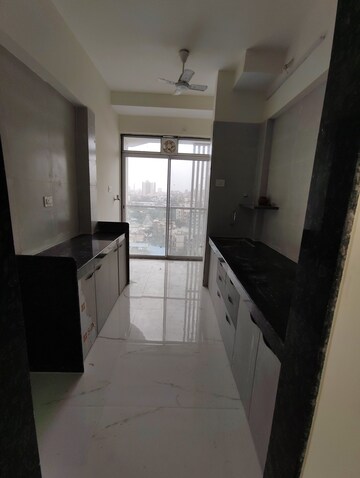 Kitchen in 2 BHK Apartment at Amar Vinay Heritage, Mira Road – for Rent