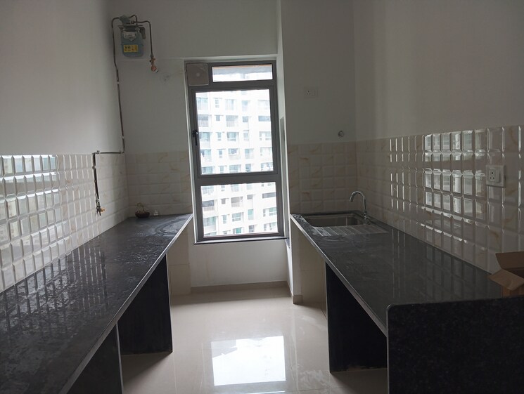 Kitchen, kalpataru-immensa 2 Bedroom 808 Sq.Ft. Apartment In Kolshet Road Thane 9088403