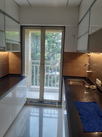 Kitchen in 1.5 BHK Apartment at Laxmi Narayan CHS Naupada, Naupada – for Sale
