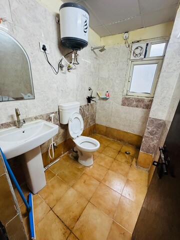Team Area in 2.5 BHK Apartment at Aims Golf City, Sector 75 – for Rent