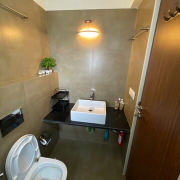 Bathroom in 2 BHK Apartment at Kanakia Hollywood, Yari Road – for Sale