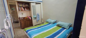 Bedroom in 2 BHK Apartment at Agarsen CHS, Koregaon – for Rent