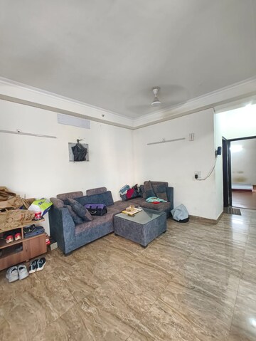 Living Room in 2 BHK Apartment at Aims Golf City, Sector 75 – for Rent