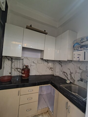 Kitchen in 2 BHK Builder Floor at Khirki Extension – for Rent
