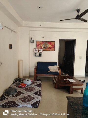 Living Room in 2.5 BHK Apartment at Aims Golf City, Sector 75 – for Rent