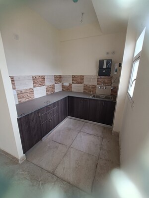 Kitchen in 2 BHK Apartment at Amrapali Enchante, Tech Zone 4 Greater Noida – for Sale