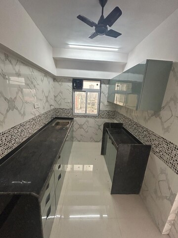 Kitchen in 1 BHK Apartment at DGS Sheetal Tapovan, Malad East – for Rent
