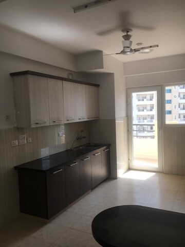 Kitchen in 4 BHK Apartment at Purvanchal Royal City, Chi V Greater Noida – for Sale