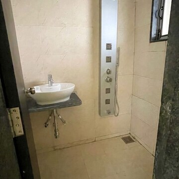 Bathroom in 1 BHK Apartment at Dev Leo Tower, Adarsh Nagar – for Rent