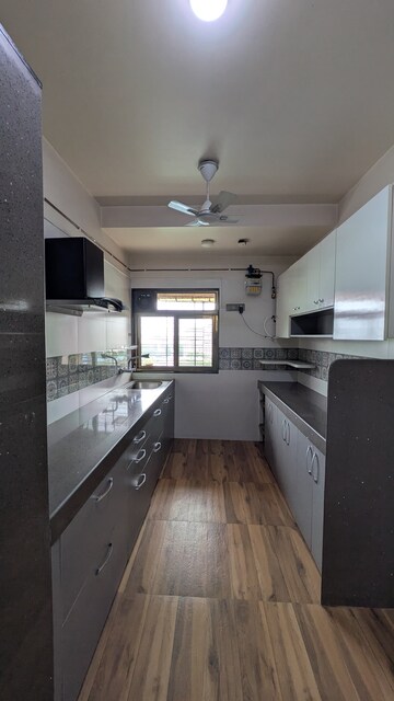 Kitchen in 2 BHK Apartment at Kalpataru Hills Phase II, Manpada – for Rent