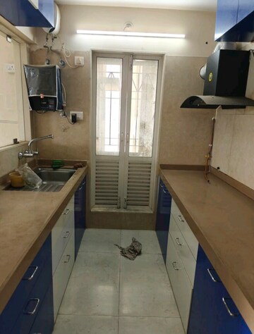 Kitchen in 2 BHK Apartment at Dosti West County, Balkum Pada – for Rent