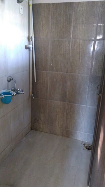 Bathroom in 1 BHK Apartment at Squarefeet Joy square, Kasarvadavali – for Rent