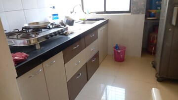 Kitchen in 1 BHK Apartment at Pushpanjali Heights, Owale – for Rent