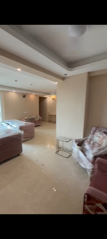 Living Room in 4 BHK Apartment at Sikka Kaamna Greens, Sector 143a Noida – for Rent
