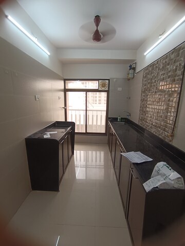 Kitchen in 2 BHK Apartment at Ninaad CHS, Malad West – for Rent