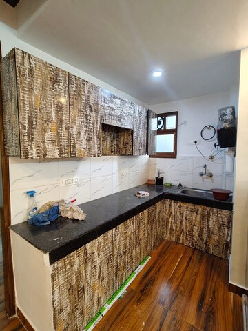 Kitchen in 2 BHK Builder Floor at Freedom Fighters Enclave – for Rent