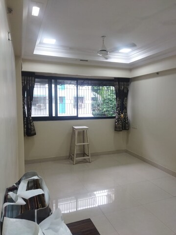 Living Room in 1 BHK Apartment at Pranam CHS Borivalli West, Borivali West – for Sale