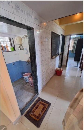 Living Room in 2 BHK Apartment at Dhanlaxmi CHS Asalpha, Asalpha – for Rent