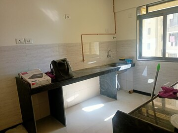 Team Area in 2 BHK Apartment at Acme Ozone, Manpada – for Rent