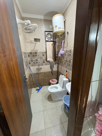Bathroom in 3 BHK Builder Floor at Laxman Vihar Phase 2 – for Sale