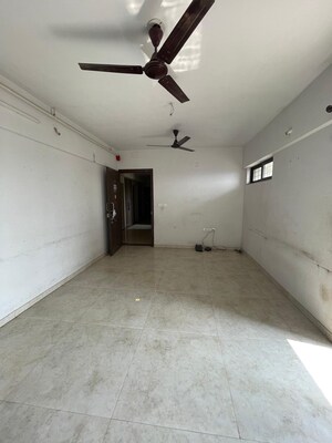 Living Room in 1 BHK Apartment at Lodha Palava Downtown, Dombivli East – for Sale