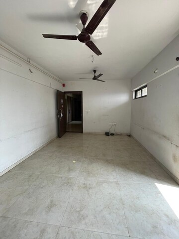 Living Room in 1 BHK Apartment at Lodha Palava Downtown, Dombivli East – for Rent