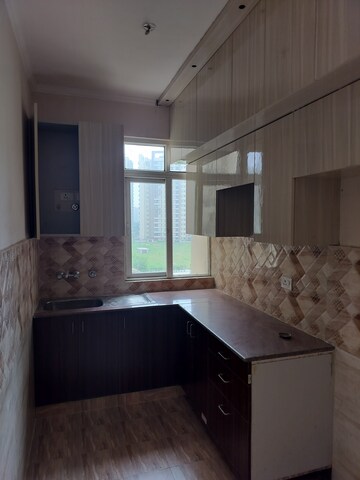 Kitchen in 3 BHK Apartment at Amrapali Golf Homes, Sector 4 Greater Noida – for Rent