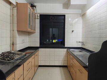 Kitchen in 3 BHK Apartment at Ajmera Golden Rays, Andheri West – for Rent