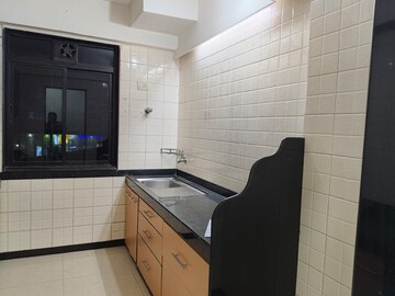 Kitchen in 3 BHK Apartment at Ajmera Golden Rays, Andheri West – for Rent