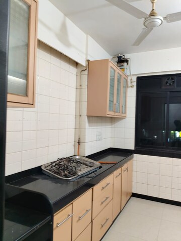 Kitchen in 3 BHK Apartment at Ajmera Golden Rays, Andheri West – for Rent
