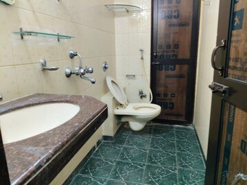 Bathroom in 3 BHK Apartment at Ajmera Golden Rays, Andheri West – for Rent