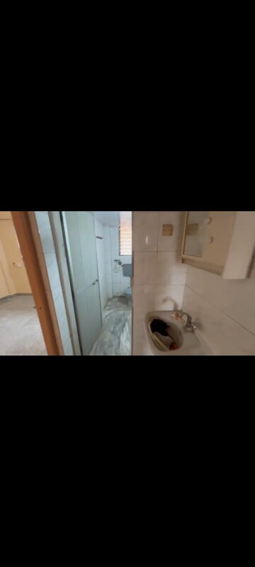 Bathroom in 2 BHK Apartment at Abhinav Apartment, Vile Parle East – for Rent
