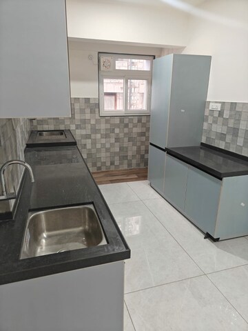 Kitchen in 2 BHK Apartment at D And T Mountain View CHS, Senapati Bapat Road – for Rent