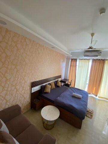 Living Room in Studio Apartment at Gaur City Center, Sector 4 Greater Noida – for Rent