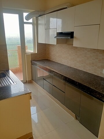 Kitchen in 2 BHK Apartment at Ansal Highland Park, Sector 103 – for Sale