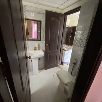 Bathroom in 2 BHK Apartment at Aims Golf Avenue I, Sector 75 – for Rent