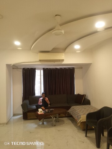 Living Room in 2 BHK Apartment at Mohini Castle, Khar West – for Rent