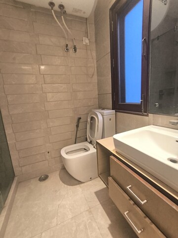 Bathroom in 3 BHK Apartment at Prithviraj Road – for Rent