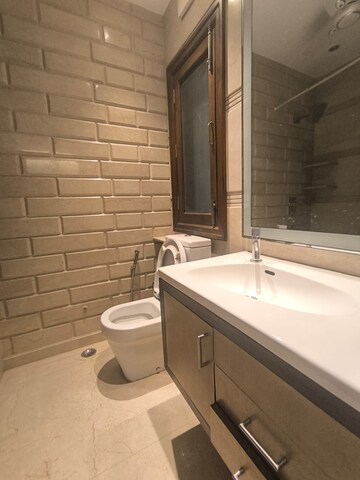 Bathroom in 3 BHK Apartment at Prithviraj Road – for Rent
