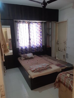 Bedroom in 2 BHK Apartment at Satellite Garden, Goregaon East – for Sale