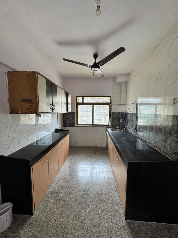 Kitchen, satellite-garden 2 Bedroom 630 Sq.Ft. Apartment In Goregaon East Mumbai 9099837