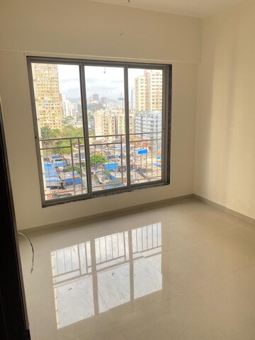 Room in 1 BHK Apartment at Dharti Pressidio, Kandivali West – for Sale