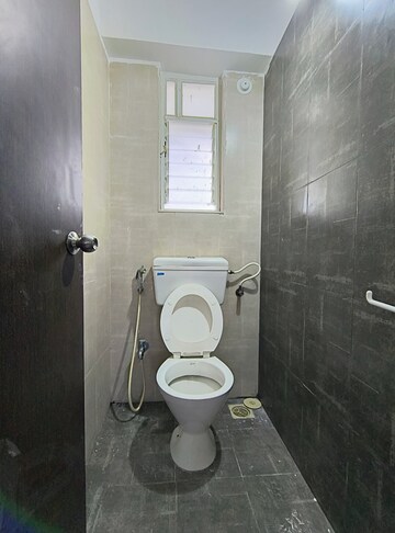 Bathroom in 1.5 BHK Apartment at Mantra Insignia, Mundhwa – for Rent